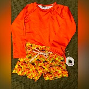 Orange Rash Guard and Yellow Floral Swim Shorts